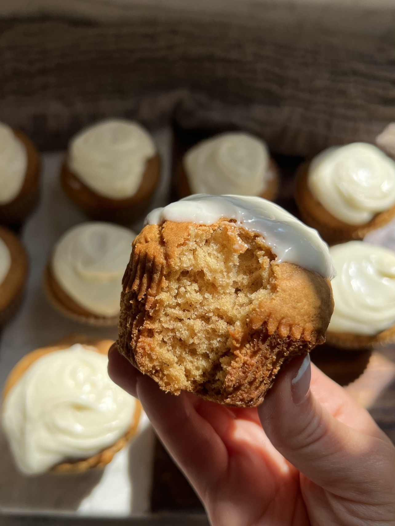 close up + bite shot of the vegan gingerbread cupcakes