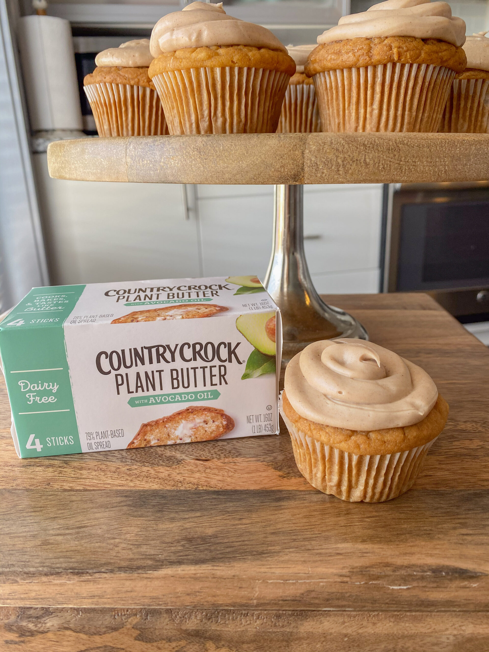 sweet potato cupcakes stacked on a cake tray with country crock plant butter