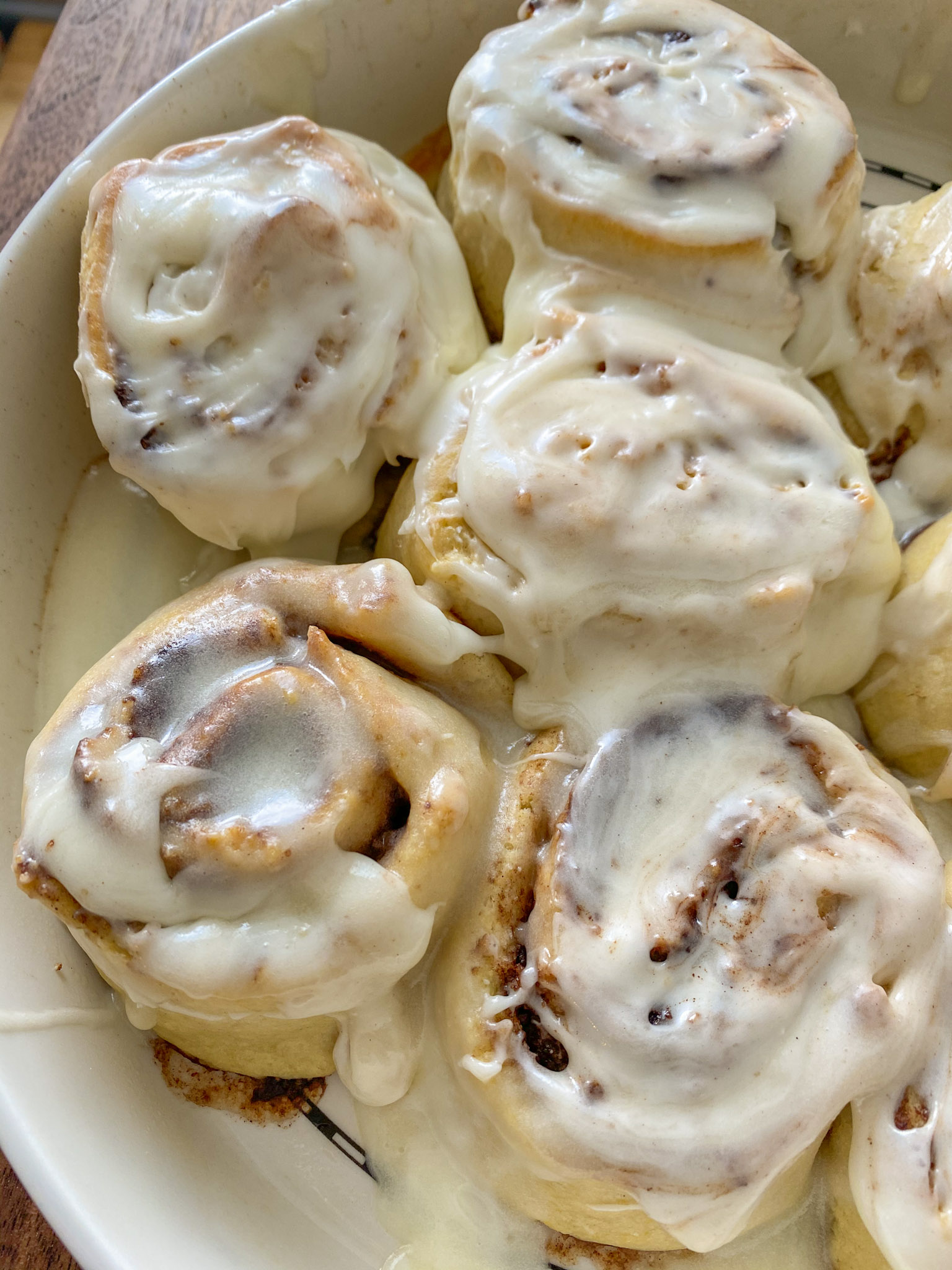 No yeast cinnamon rolls with icing on a plate.