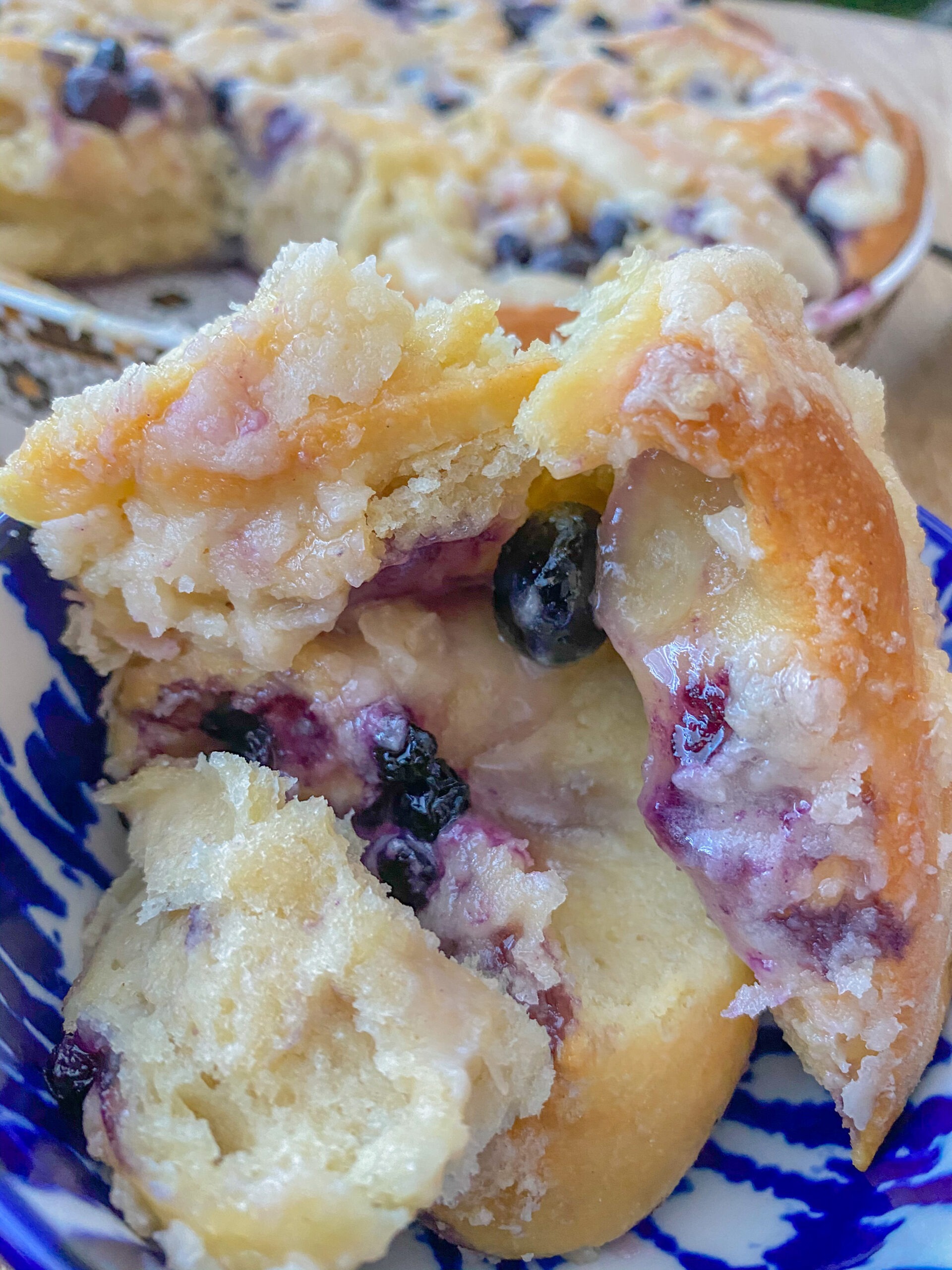 close up of frosted blueberry sweet rolls