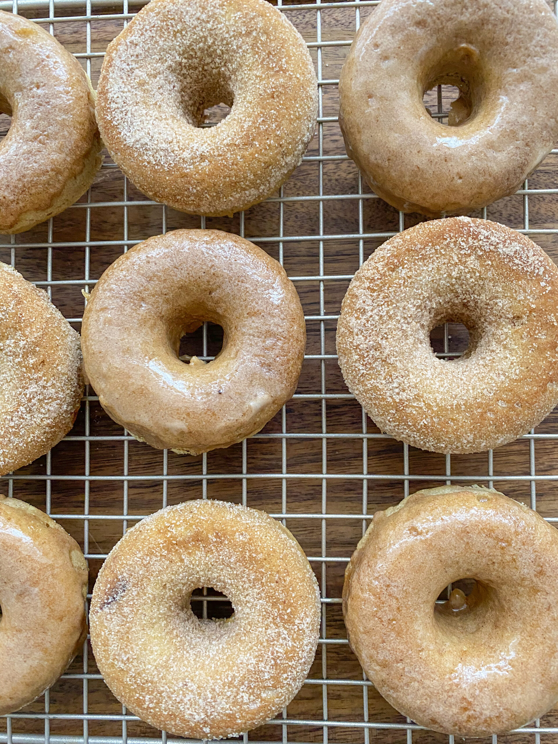 Easy Vegan Apple Cider Donuts on a wire rack.