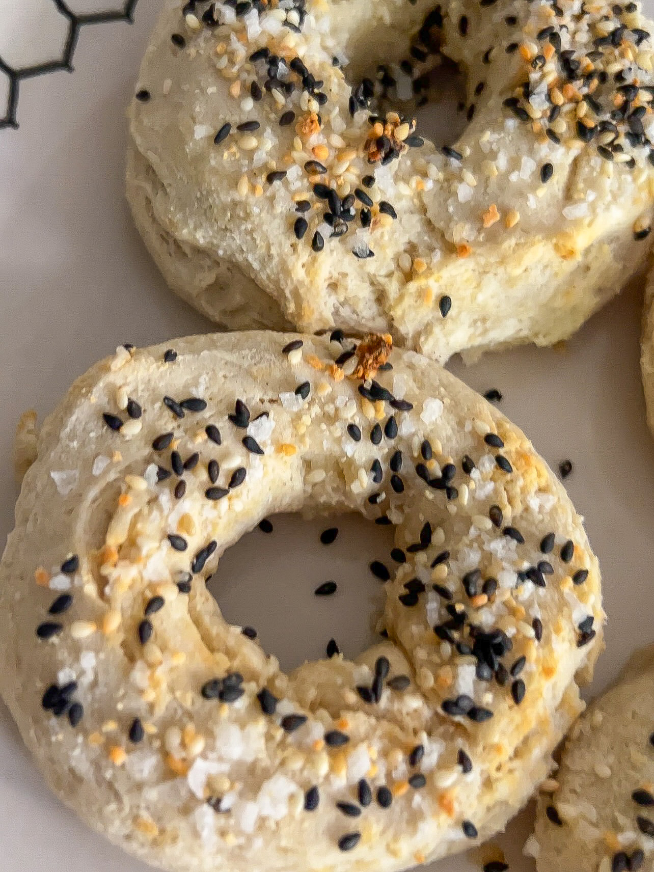 Homemade bagels topped with everything bagel seasoning.