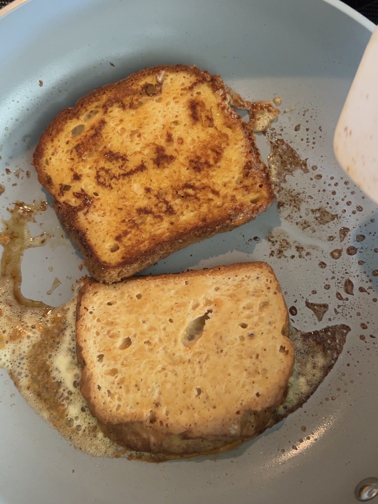 frying the pumpkin french toast in a skillet