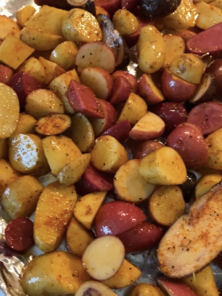 Potatoes before being roasted in an even layer on a baking sheet. 