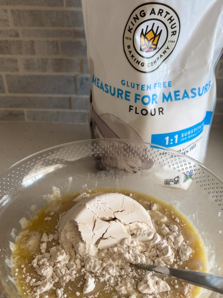 adding the gluten-free flour to the batter. 