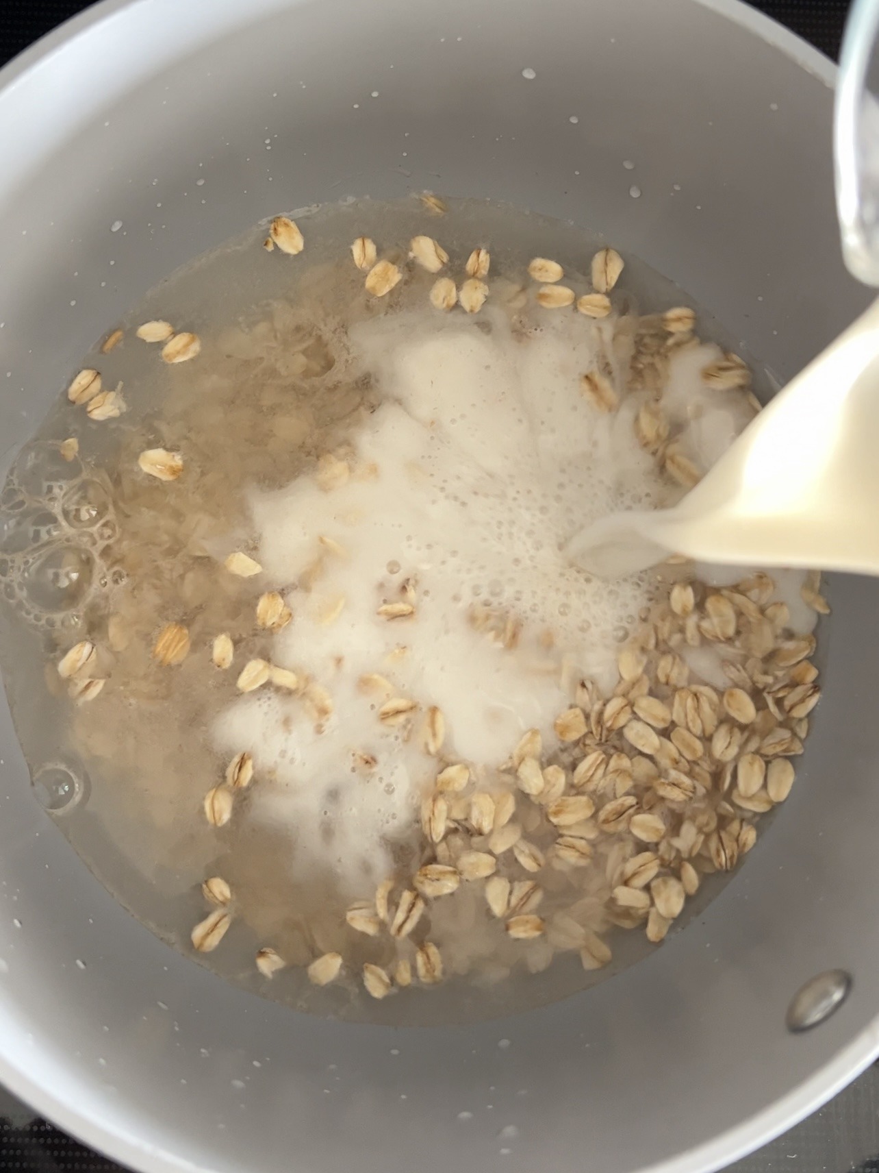 How To Make Vegan Protein Oats Step 1: Heat the oats, water, and milk on the stovetop (preferred) or in the microwave.