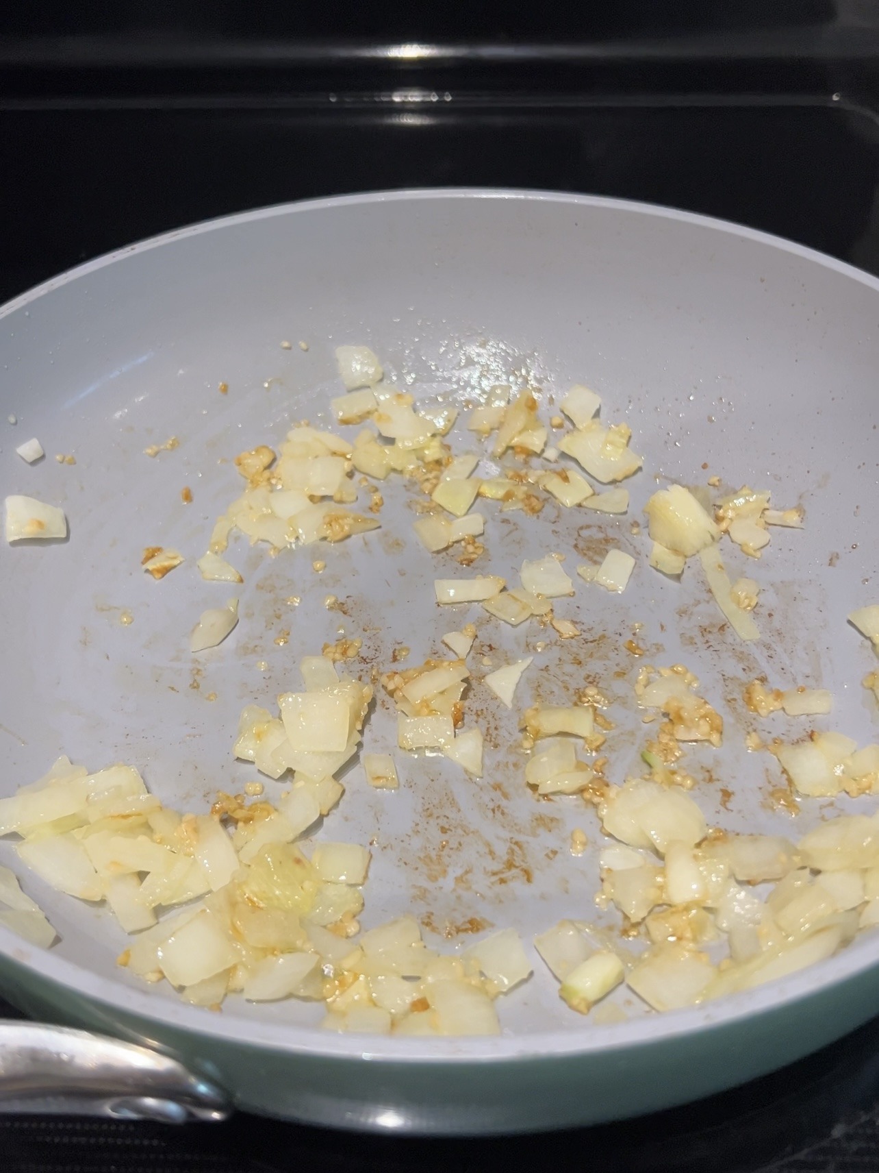 Step 1: Bring a medium skillet with olive oil to medium heat. Add the onions and cook, stirring, for 2 minutes or until they are fragrant. Then, add the garlic and cook for another 2 minutes.