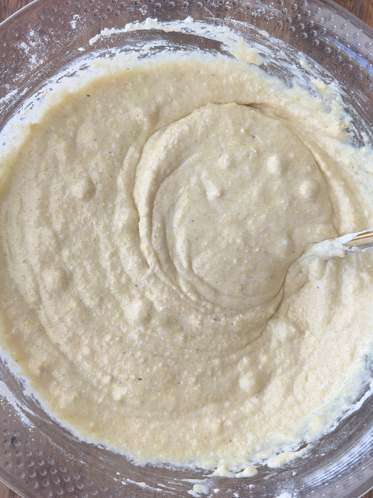 Step 2: Add the corn and mix. Then, add the cornmeal and regular or gluten free all purpose flour. Mix until a thick batter forms.