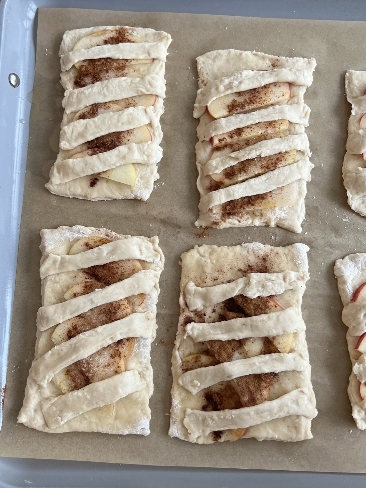Step 4: Cut the scraps of dough that are leftover into strips and place them neatly over each hand pie. Brush the top with butter and then bake in the oven until the healthy apple pies are golden.