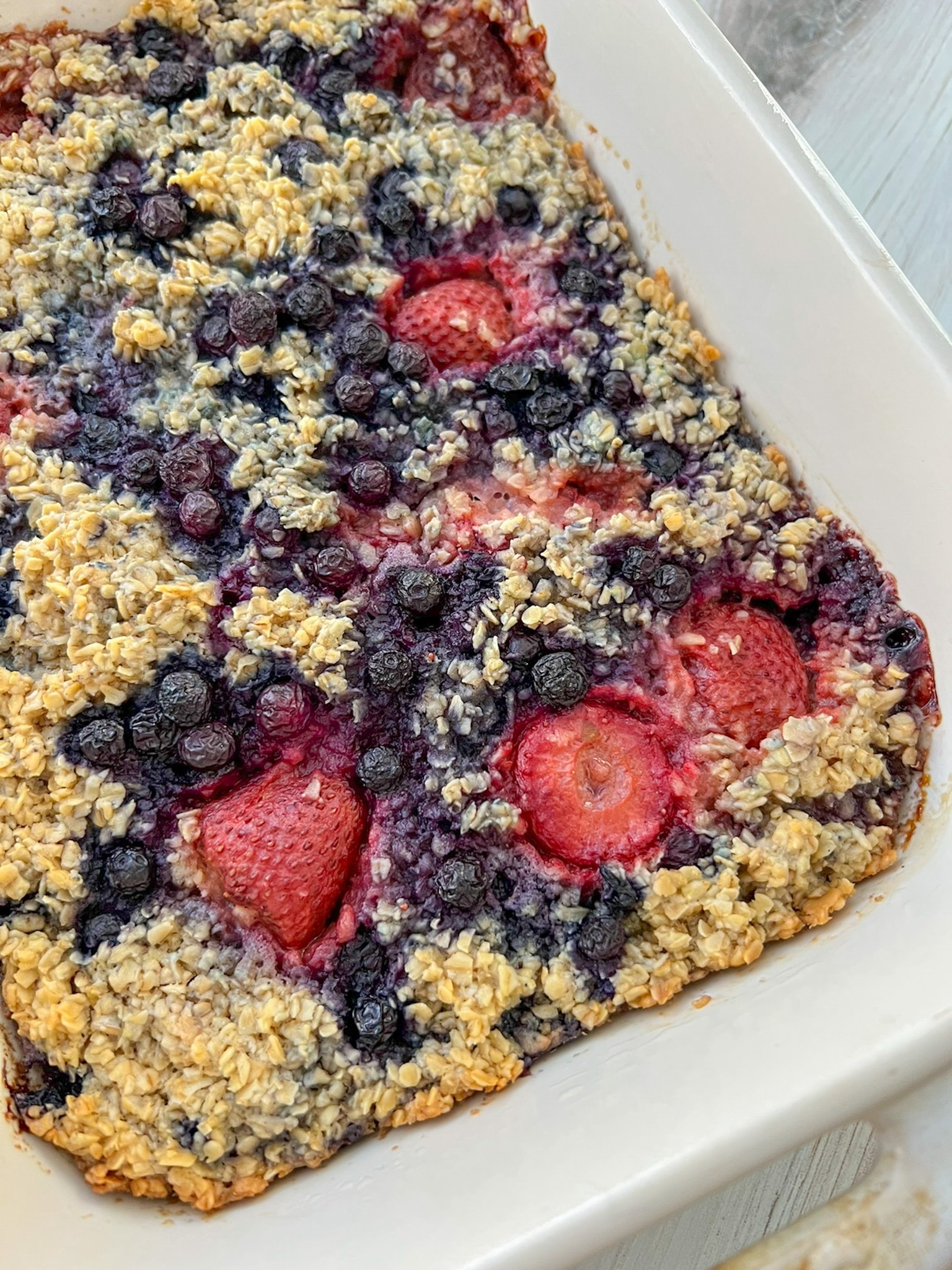 freshly baked and unfrosted mixed berry baked oatmeal