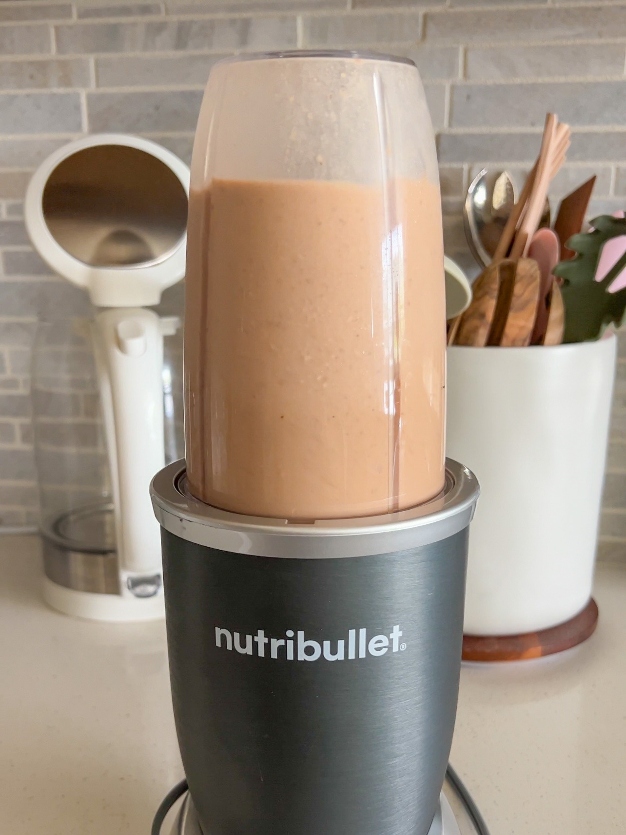 blending the chocolate protein shake in the blender