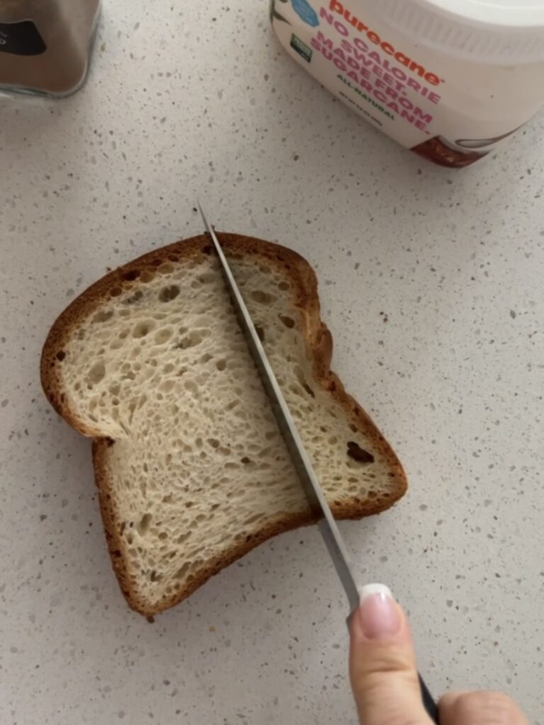 Slicing a piece of bread into thirds.