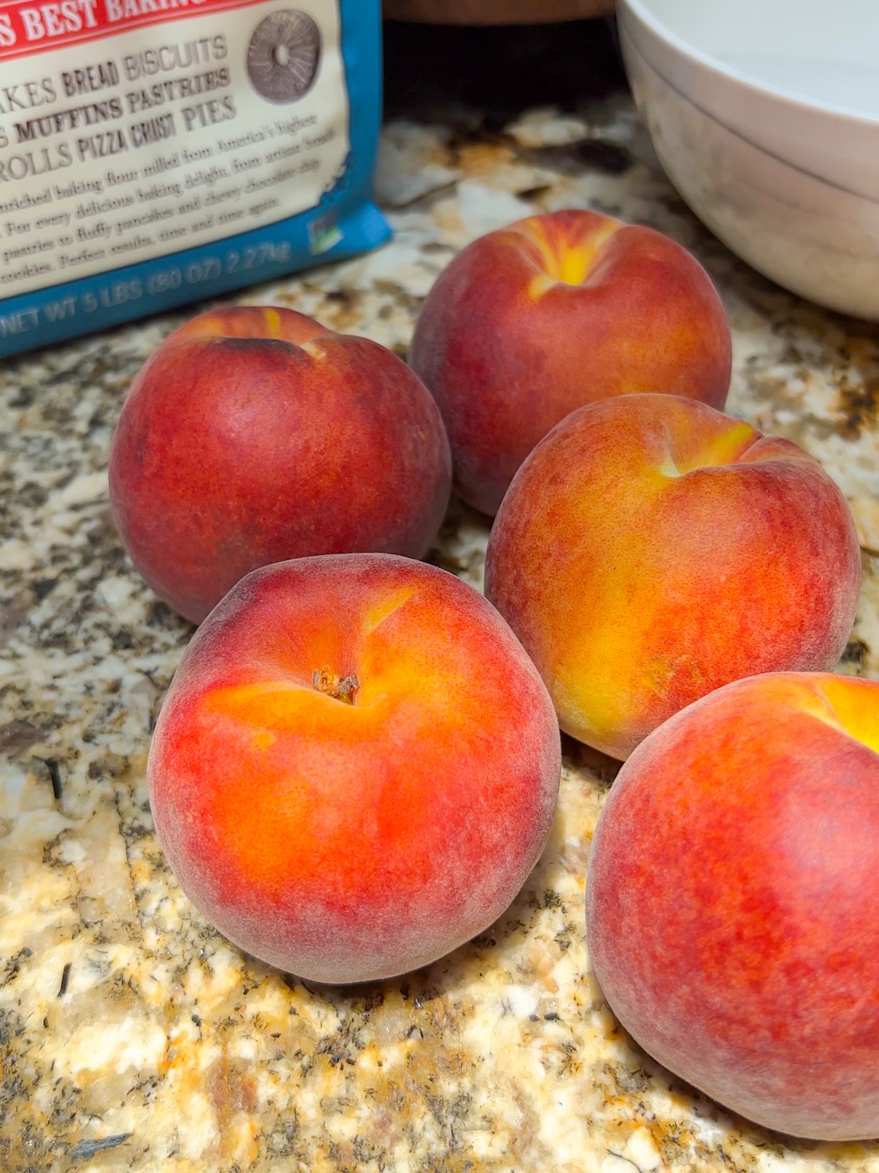 Peaches before peeling and removing the pit.