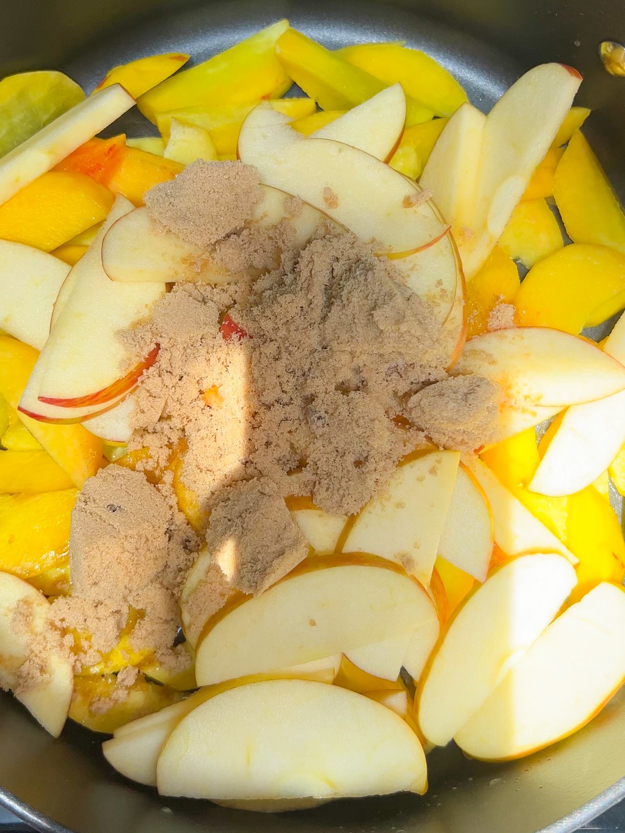 sliced peaches and apples with brown sugar