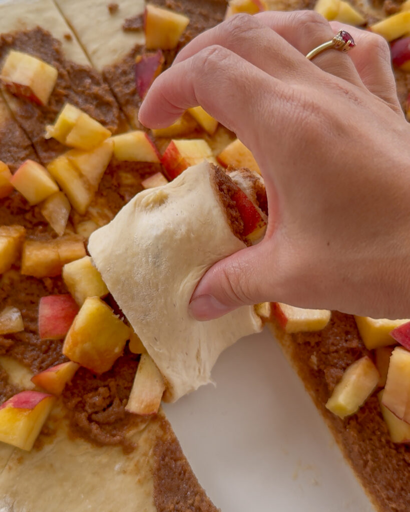peach cobbler cinnamon rolls - rolling